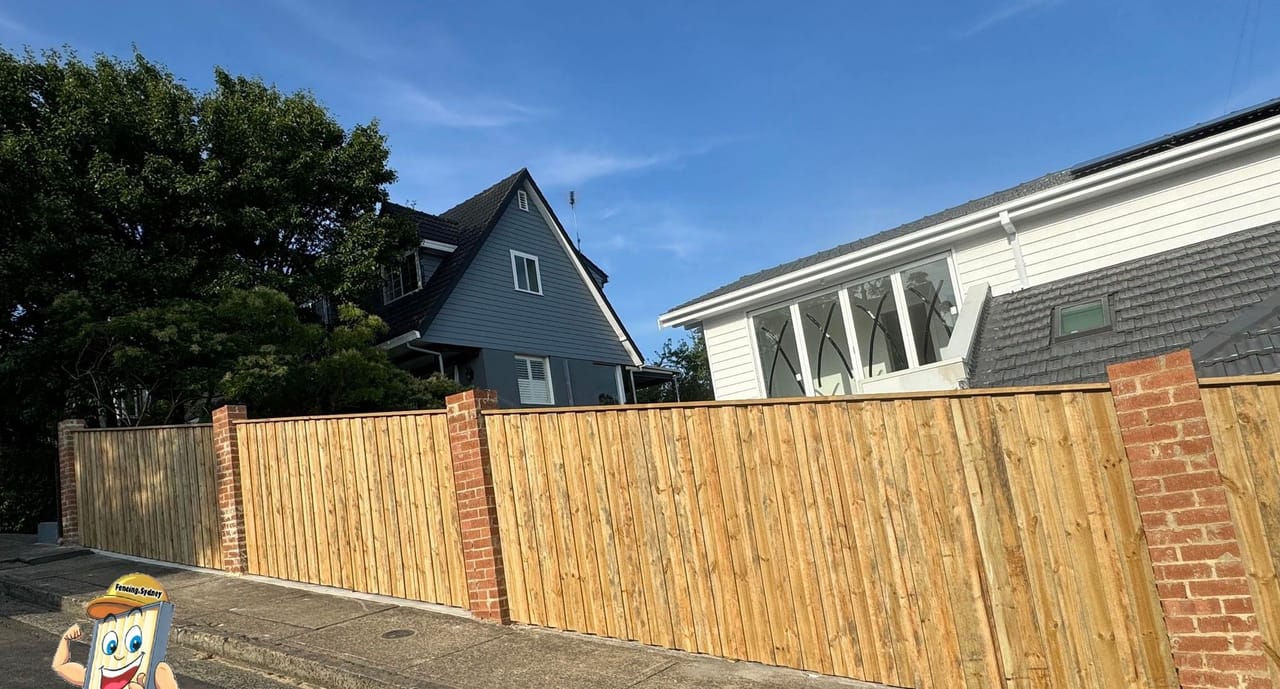 Treated pine timber fence along the street frontage of a weatherboard home in Sydney